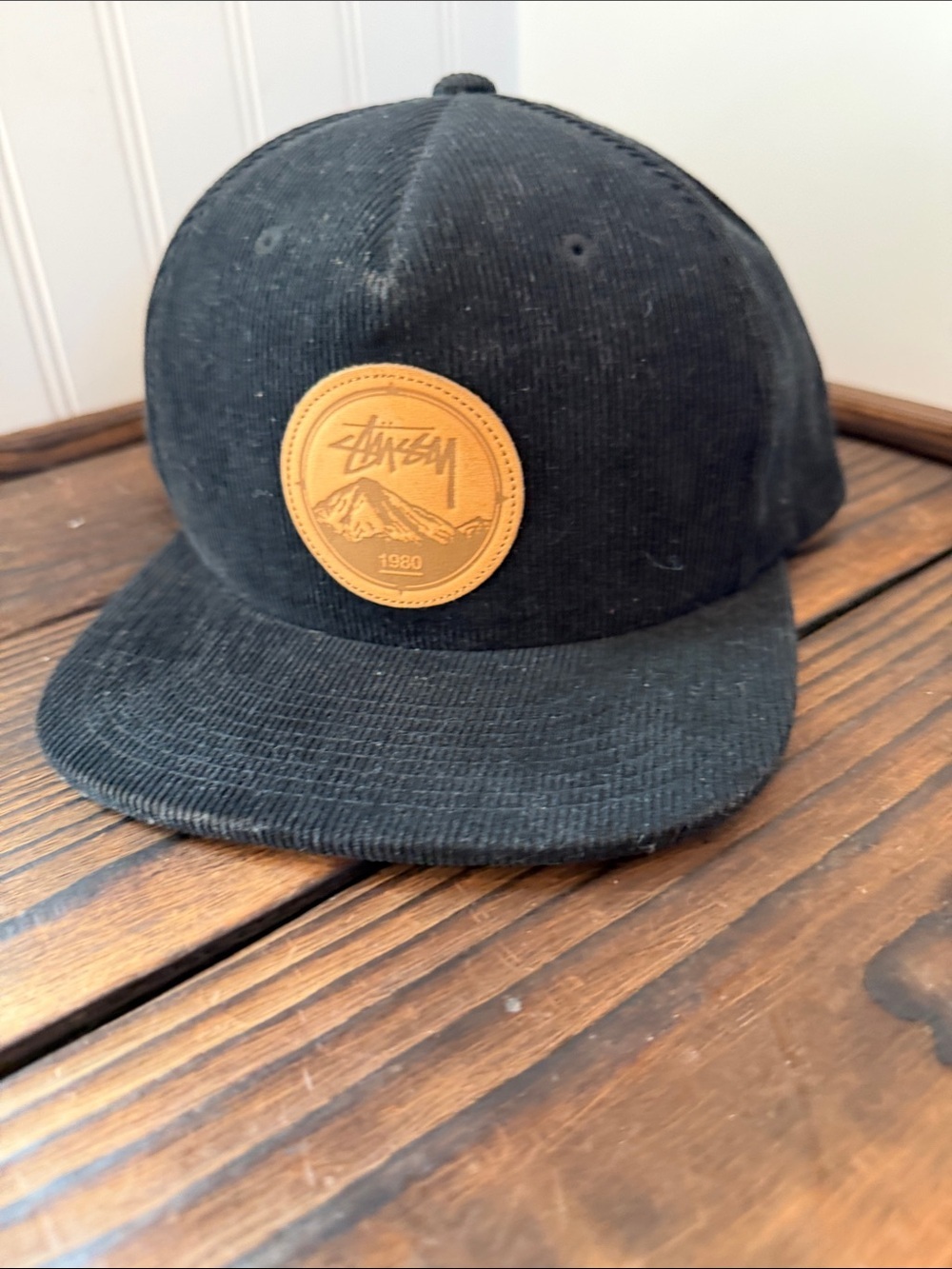 Stussy Black Corduroy Snapback Cap with Tan Leather Patch